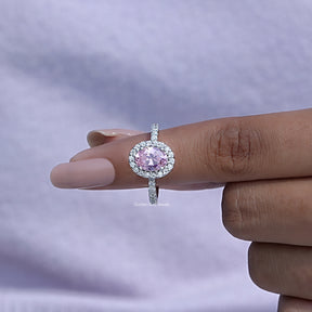 In finger front View of Oval Cut Halo Engagement Ring In White Gold