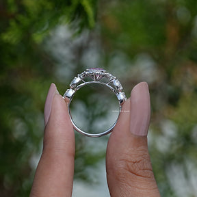 Back View of Pear Shaped Accent Stone Ring in two fingers
