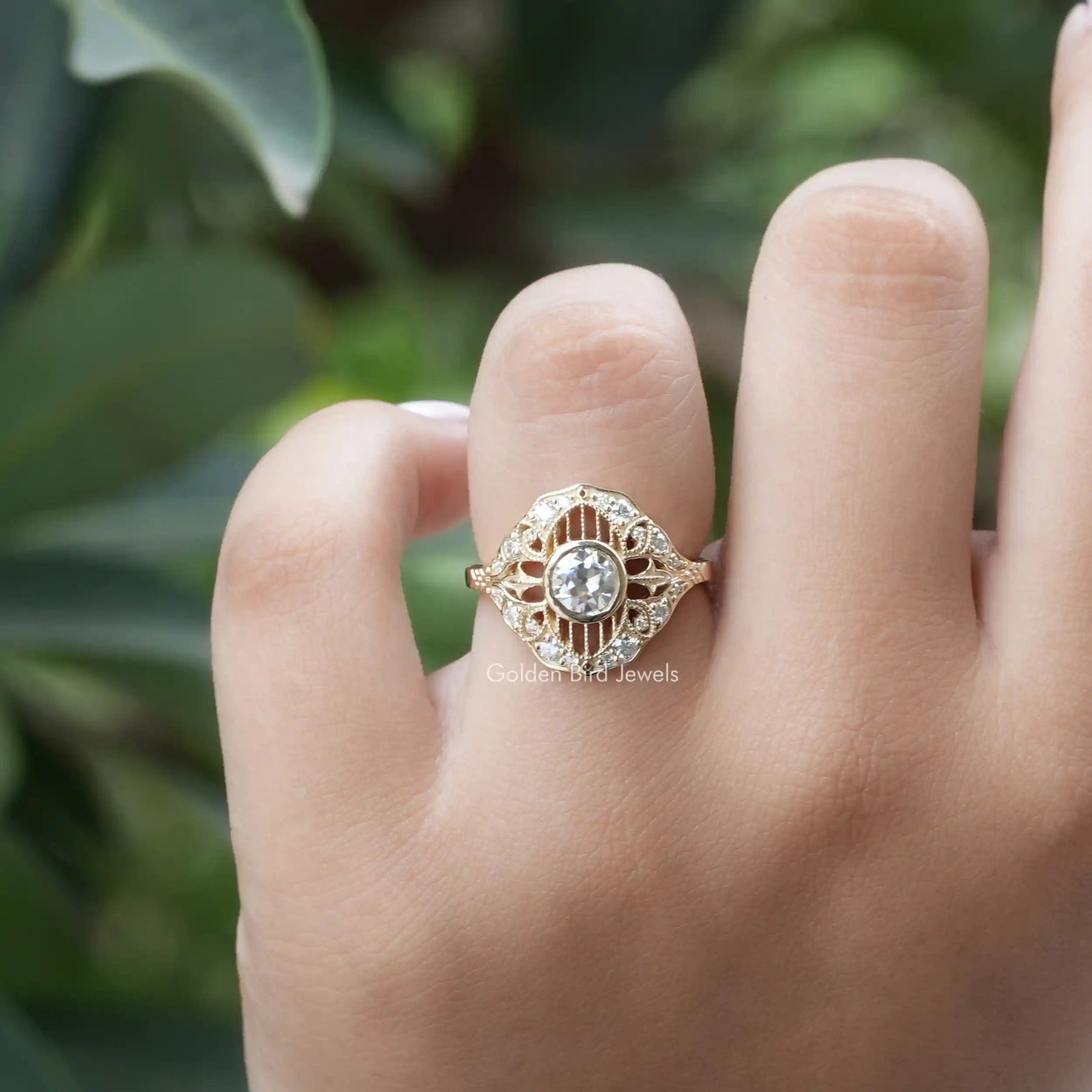 [In finger frond view of round cut vintage style ring made of vvs clarity]-[Golden Bird Jewels]