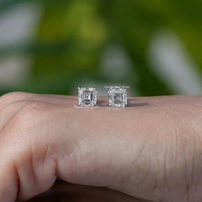 In hand view of lab diamond stud earings 