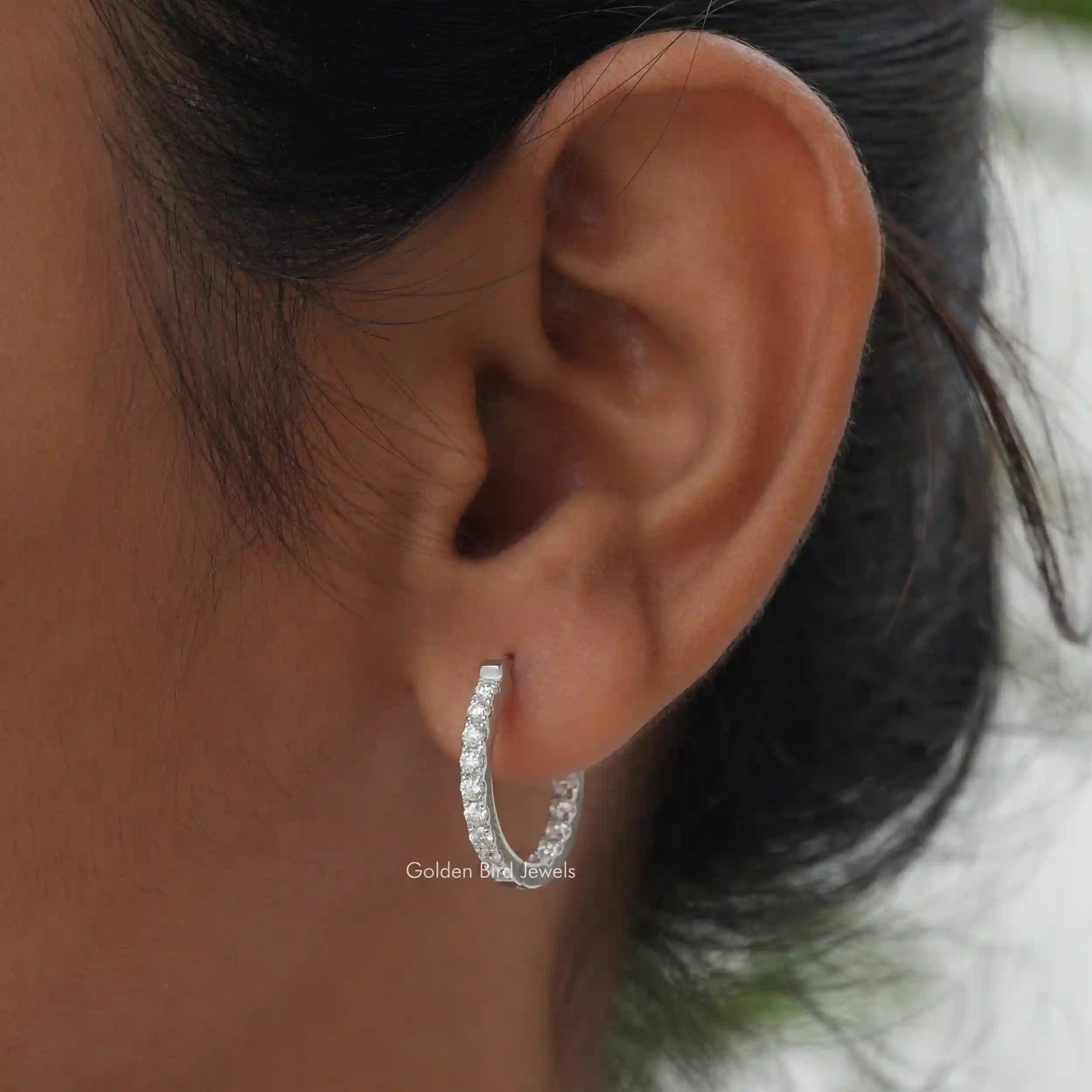 [In ear front view of round cut moissanite earrings]-[Golden Bird Jewels]