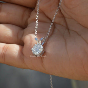 On hand front view of white gold Portuguese cut pendant