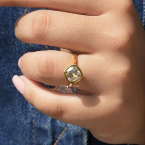 [In finger front view of yellow gold cushion cut moissanite ring]-[Golden Bird Jewels]