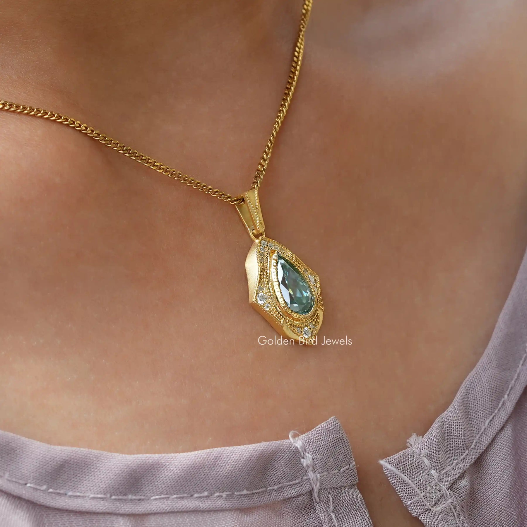 [In neck front view of yellow gold pear cut moissanite pendant]-[Golden Bird Jewels]