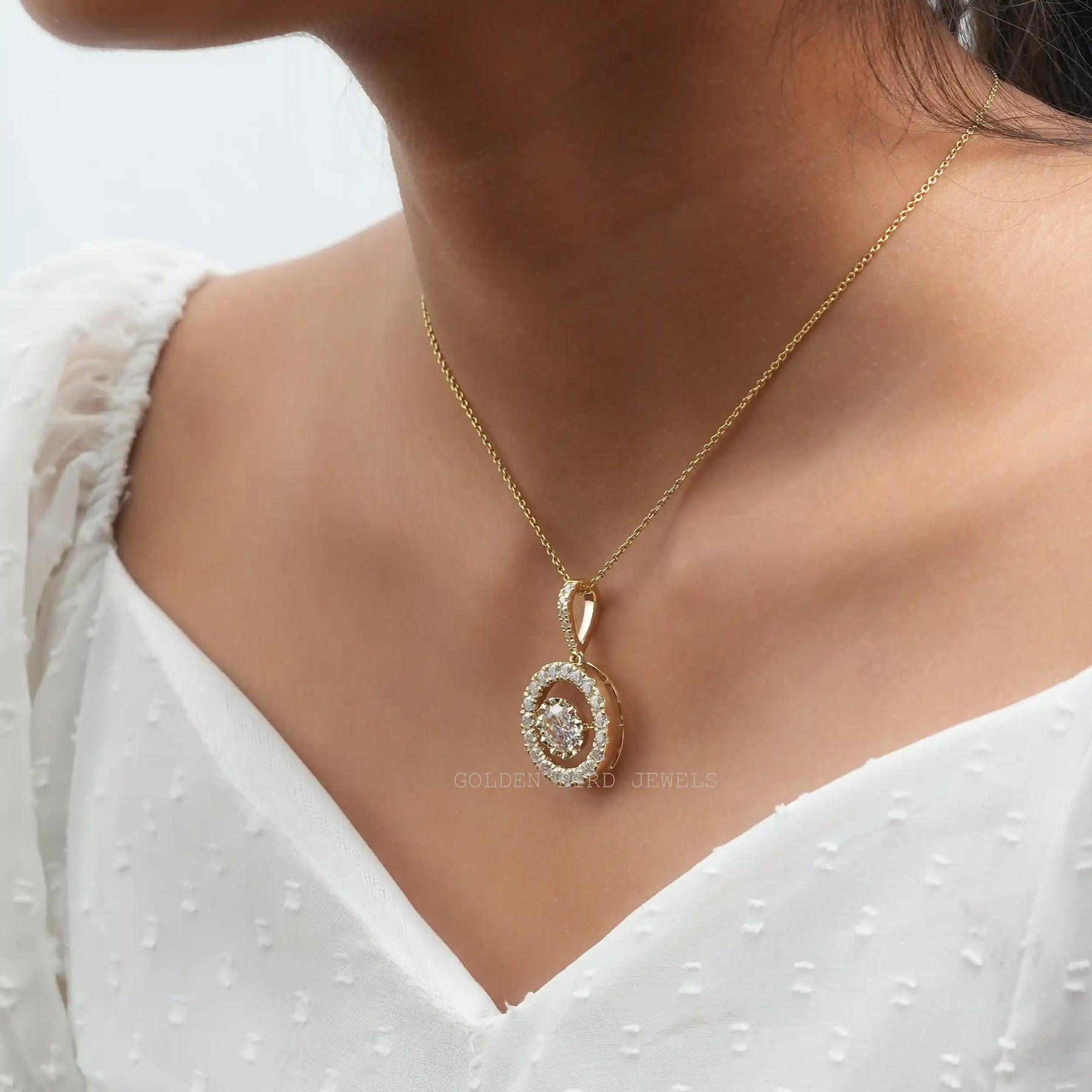 [In neck front view of yellow gold round cut moissanite pendant]-[Golden Bird Jewels]