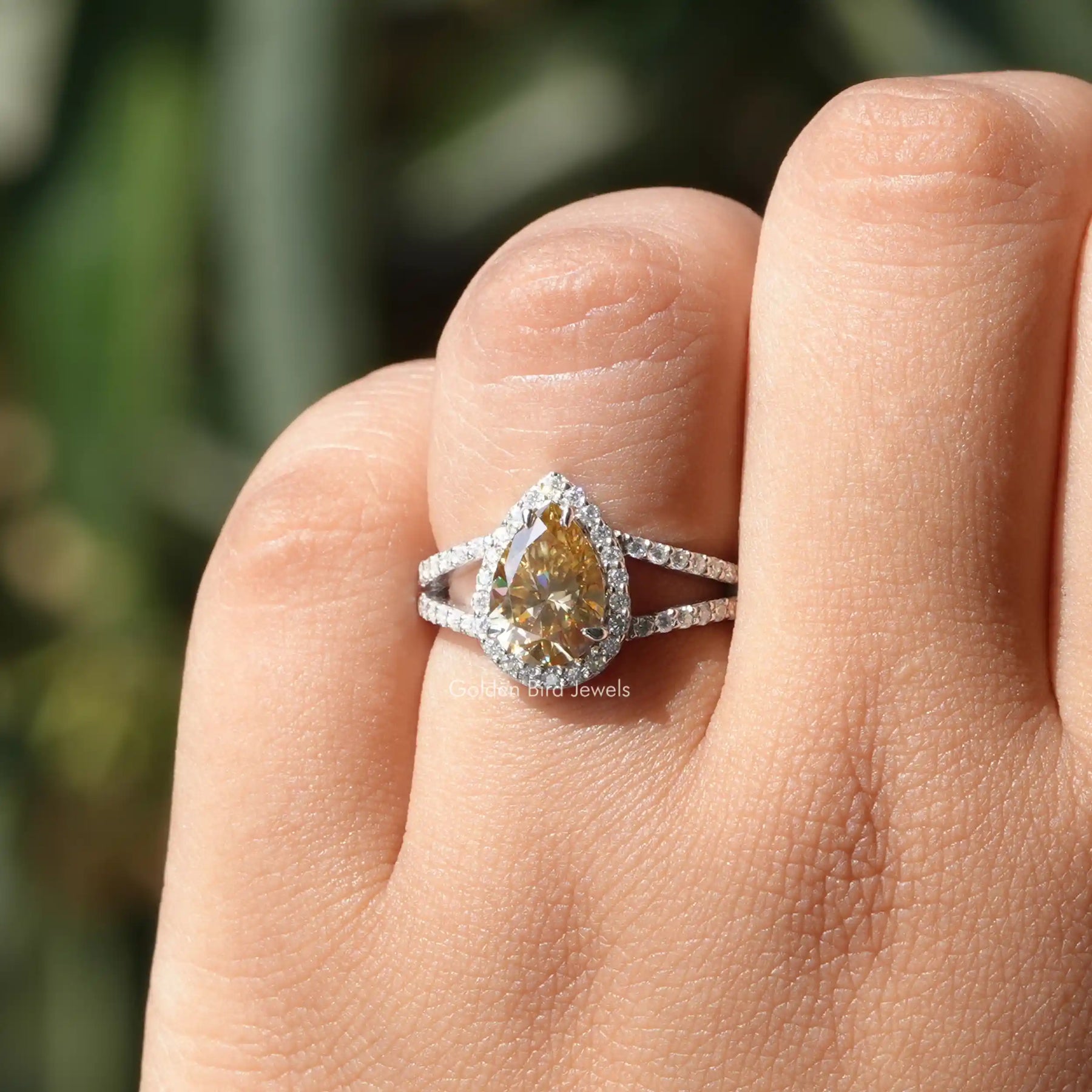 [In finger front view of yellow pear cut moissanite ring]-[Golden Bird Jewels]