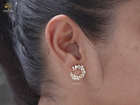Baguette Moissanite Sideway Spiral Hoop Earrings