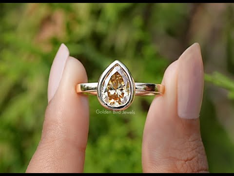 You tube Video Of Pear Cut Yellow Moissanite Bezel Set Solitaire Ring