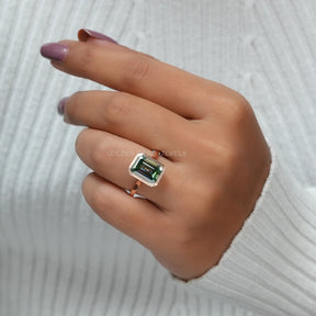 In Finger View Of Green Emerald Cut Bezel Set Moissanite Ring