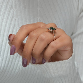 In Finger Side View Of Emerald Cut Bezel Set Moissanite Solitaire Engagement Ring