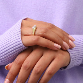 In finger side view of marquise cut moissanite knife adge shank engagement ring