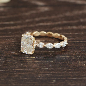 View of Radiant & Pear Shaped Moissanite Hidden Halo Ring In Yellow Gold
