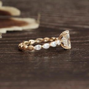 View of Radiant & Pear Shaped Moissanite Ring In 18k Yellow Gold