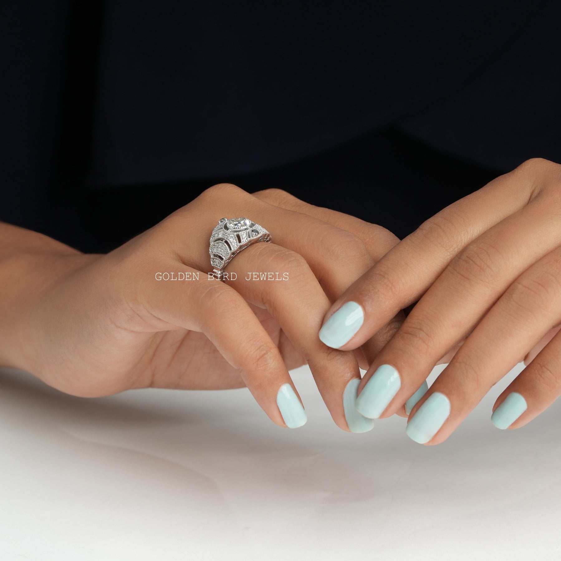 [In finger side view of old european round cut moissanite bridal art deco ring]