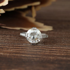 [A white gold engagement ring with a colorless stone in the center]-[Golden Bird Jewels]