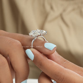 In finger front View of Pear And Oval Cut Moissanite In White Gold
