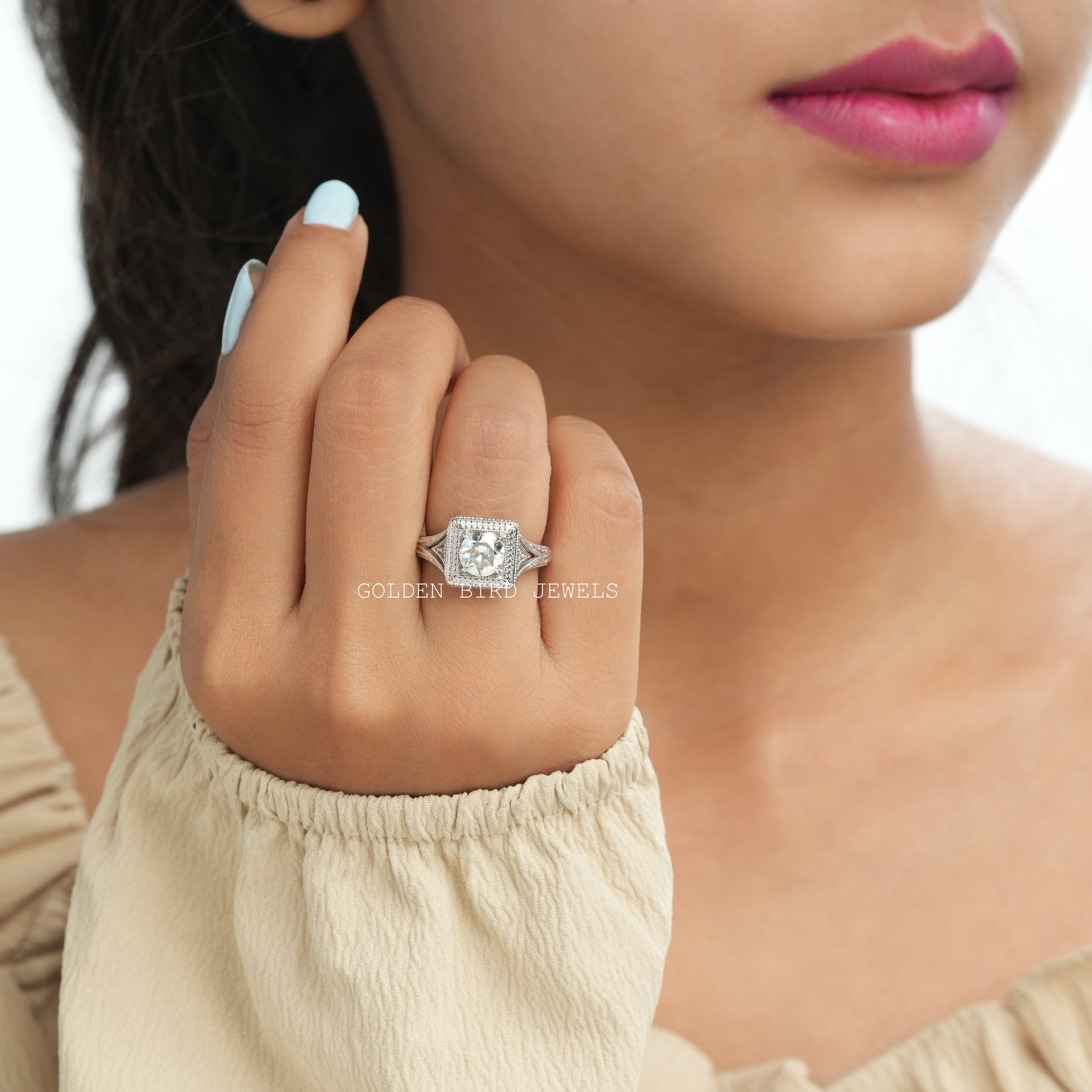 [Slightly folded front view of 14k white gold OEC round ring]