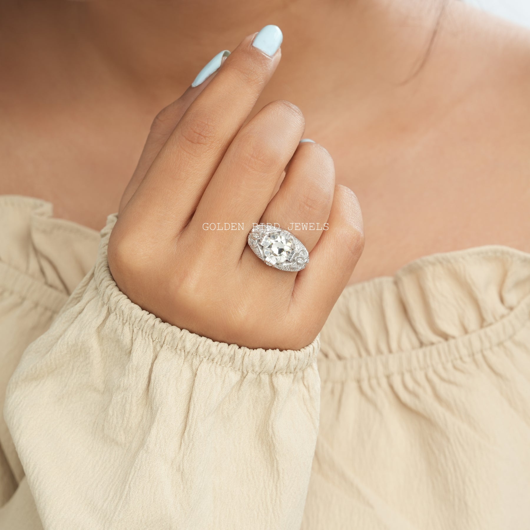 [A woman wearing a white stone moissanite engagement ring]-[Golden Bird Jewels]