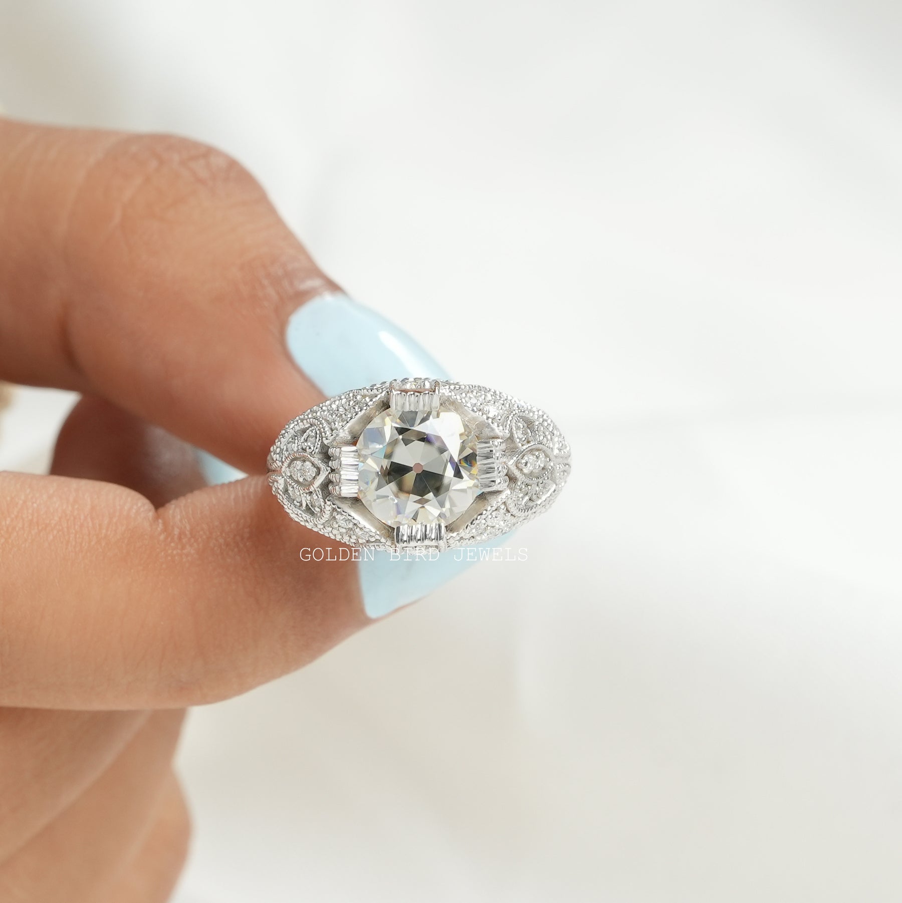 [This rmoissanite ring set in oec round cut stone with prong setting]-[Golden Bird Jewels]
