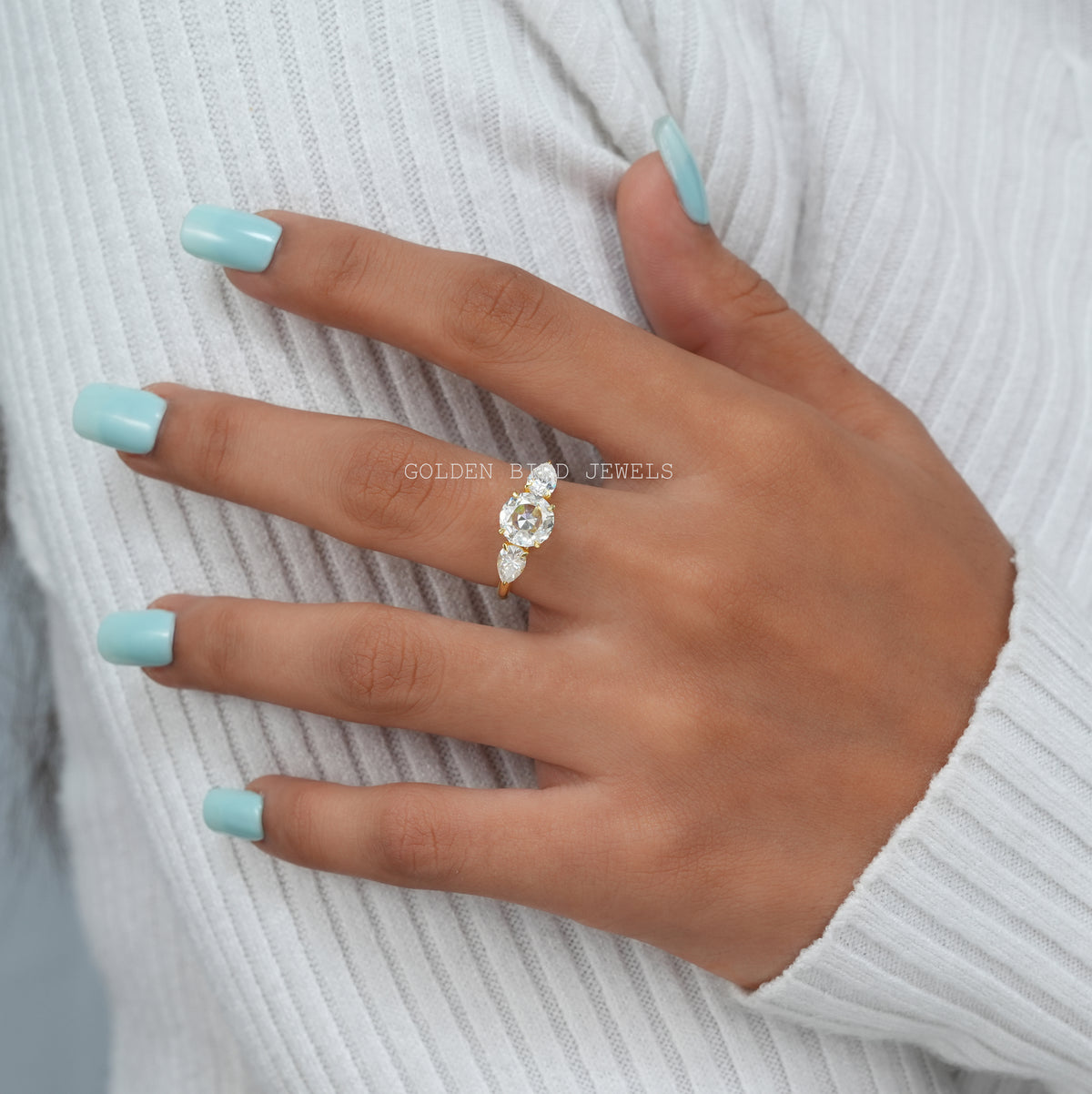 View of Moissanite Three Stone Round Cut Engagement Ring In Finger