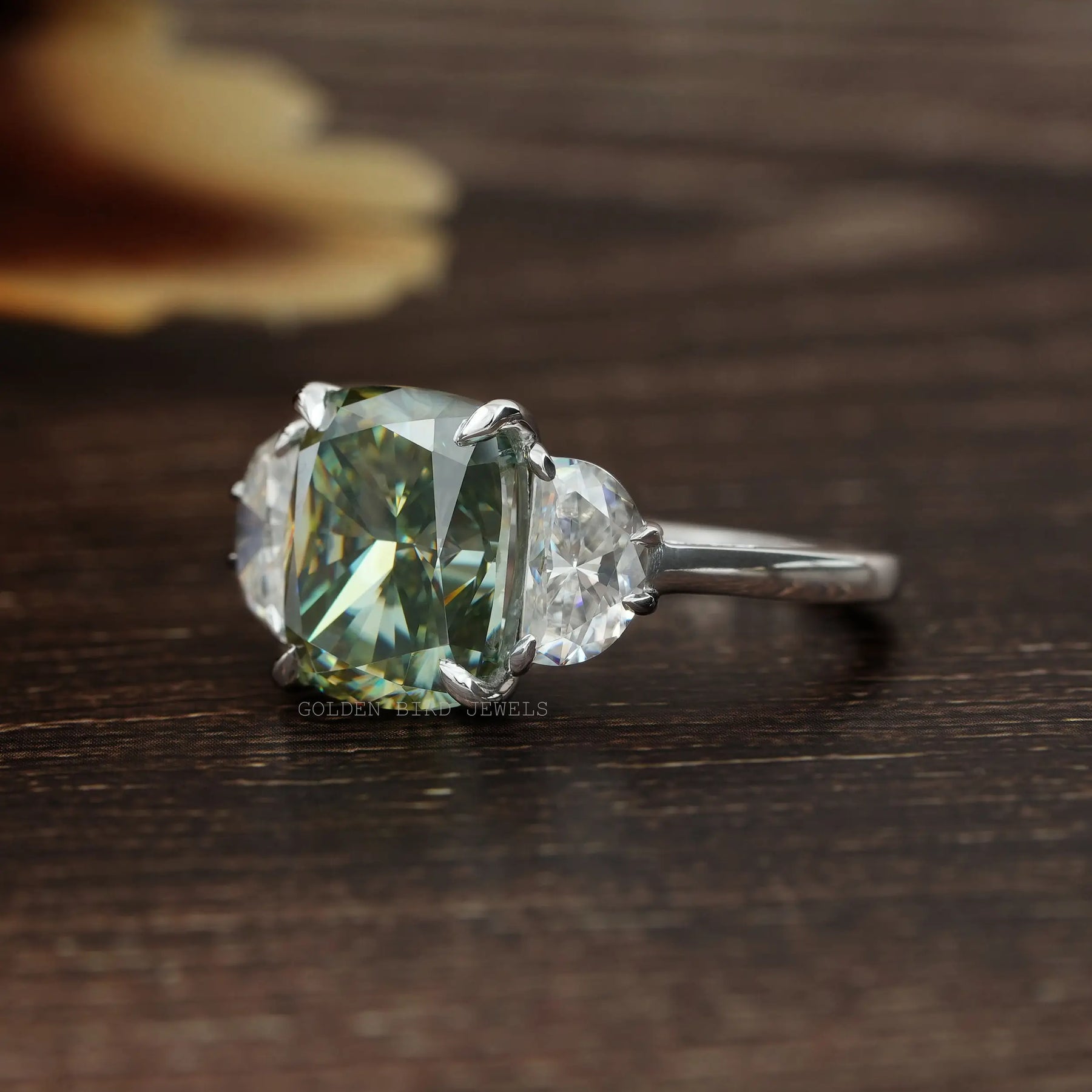 Left Side View Of Cushion Cut Green Moissanite Three Stone Ring