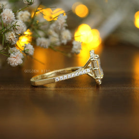 View of Emerald And Baguette Halo Moissanite Ring In Finger