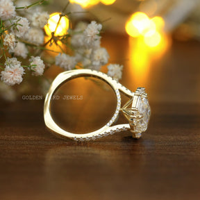 View of Emerald And Baguette Moissanite Halo Ring In Yellow Gold 