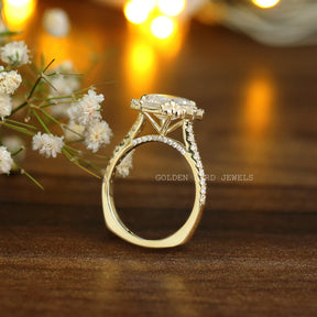 Detailed View Of Emerald And Baguette Cut Moissanite Engagement Ring In Yellow Gold