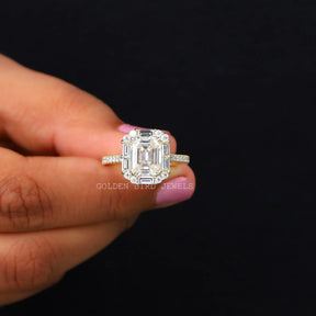 Front View of Emerald Cut Moissanite Engagement Ring In two Fingers
