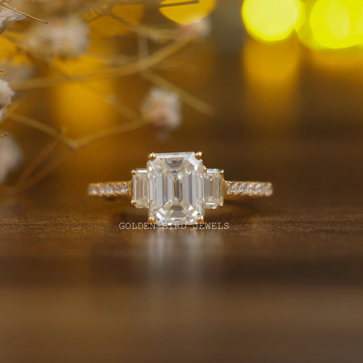 Colorless Emerald Cut Three Stone Moissanite Engagement Ring