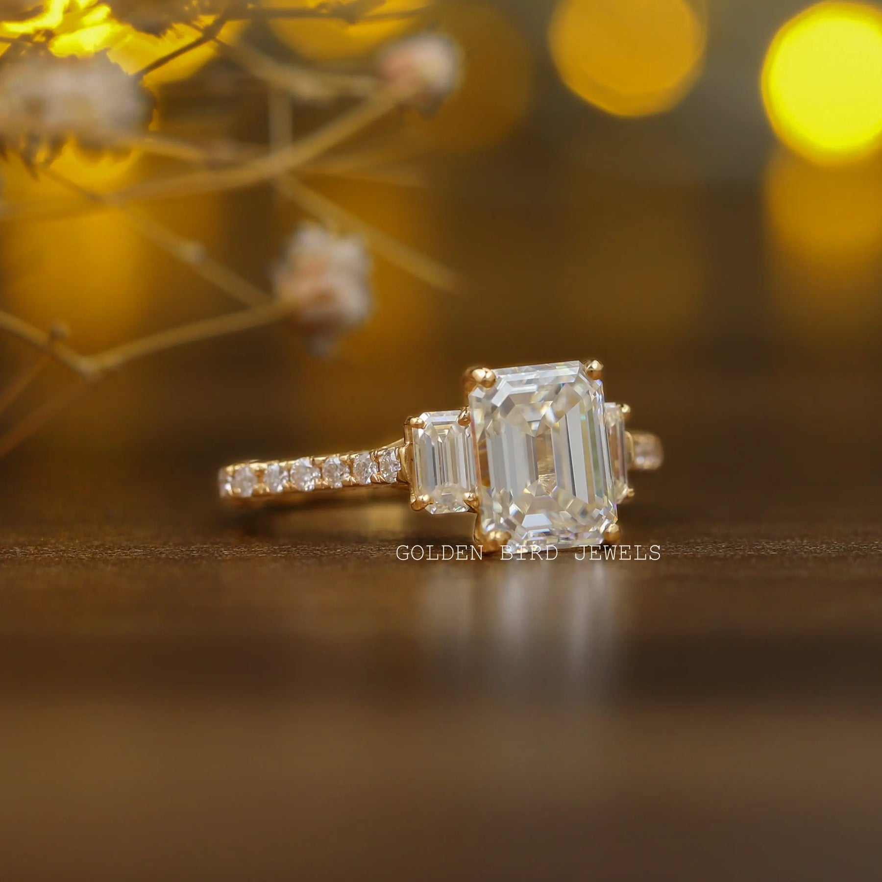 Three stone ring emerald cut deals
