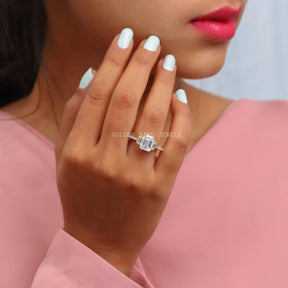 In Finger View Of 3 Stone Emerald Cut Moissanite Ring