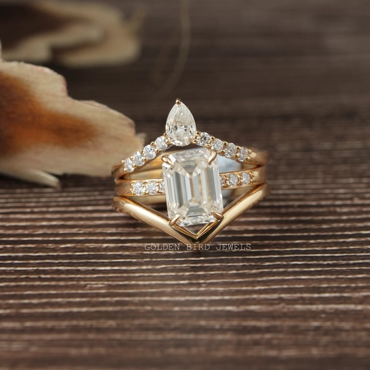 View of Emerald Cut Moissanite Bridal Trio Ring Curved Band In Yellow Gold