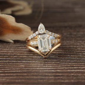 View of Emerald Cut Moissanite Bridal Trio Ring Curved Band In Yellow Gold