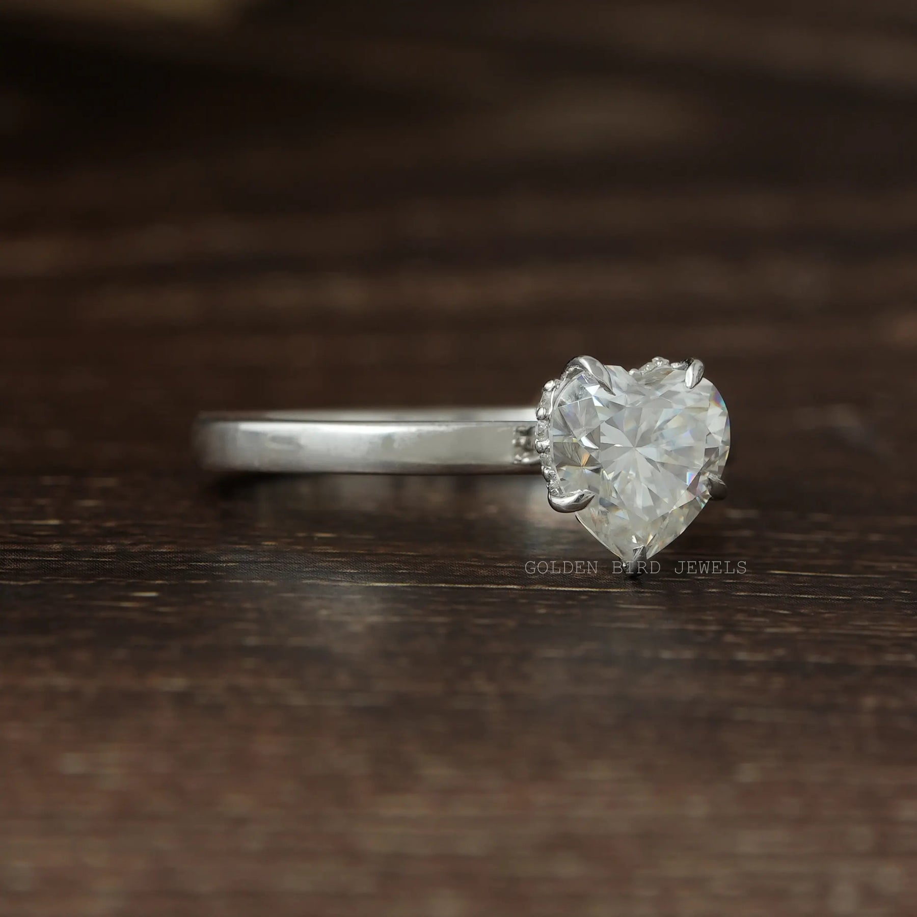 right side look of heart cut moissanite solitaire ring made with 14K white gold