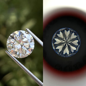 Tweezers holding the Heart And Arrow Round Cut Loose Moissanite 