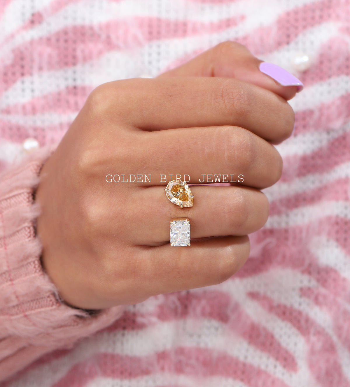 In finger view of Yellow pear and white radiant moissanite ring 