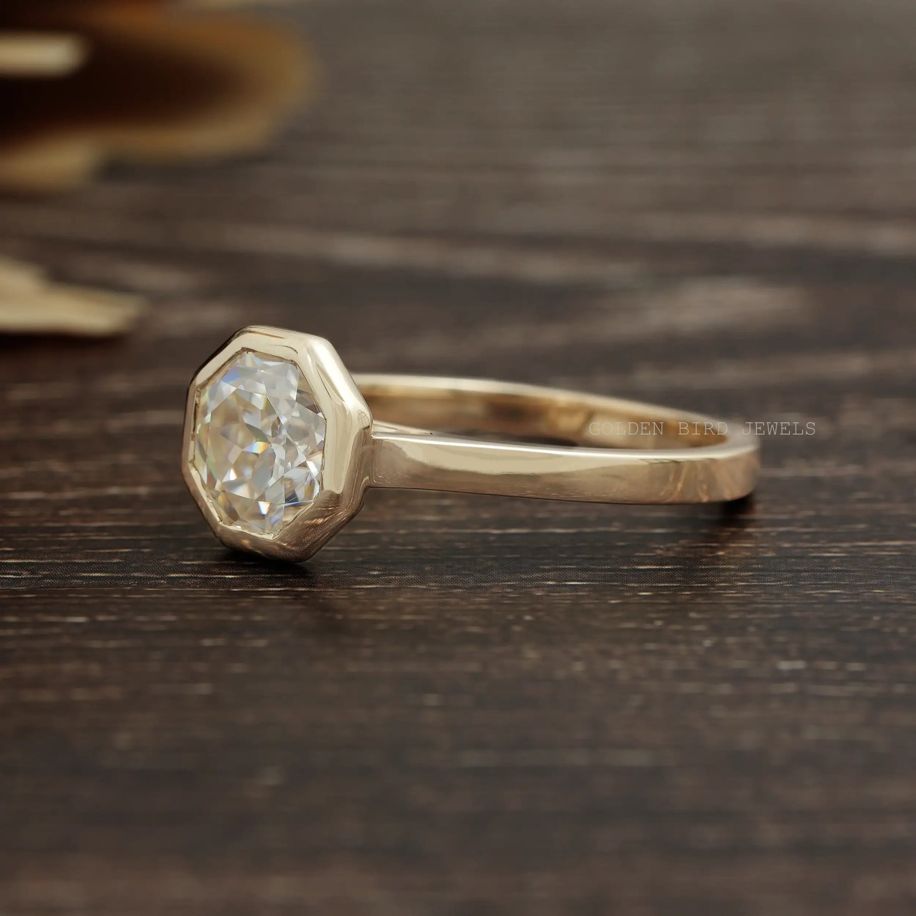 Left Side View Of 14K Yellow Gold Octagon Cut Solitaire Bezel Set Engagement Ring