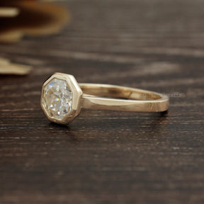 Left Side View Of 14K Yellow Gold Octagon Cut Solitaire Bezel Set Engagement Ring
