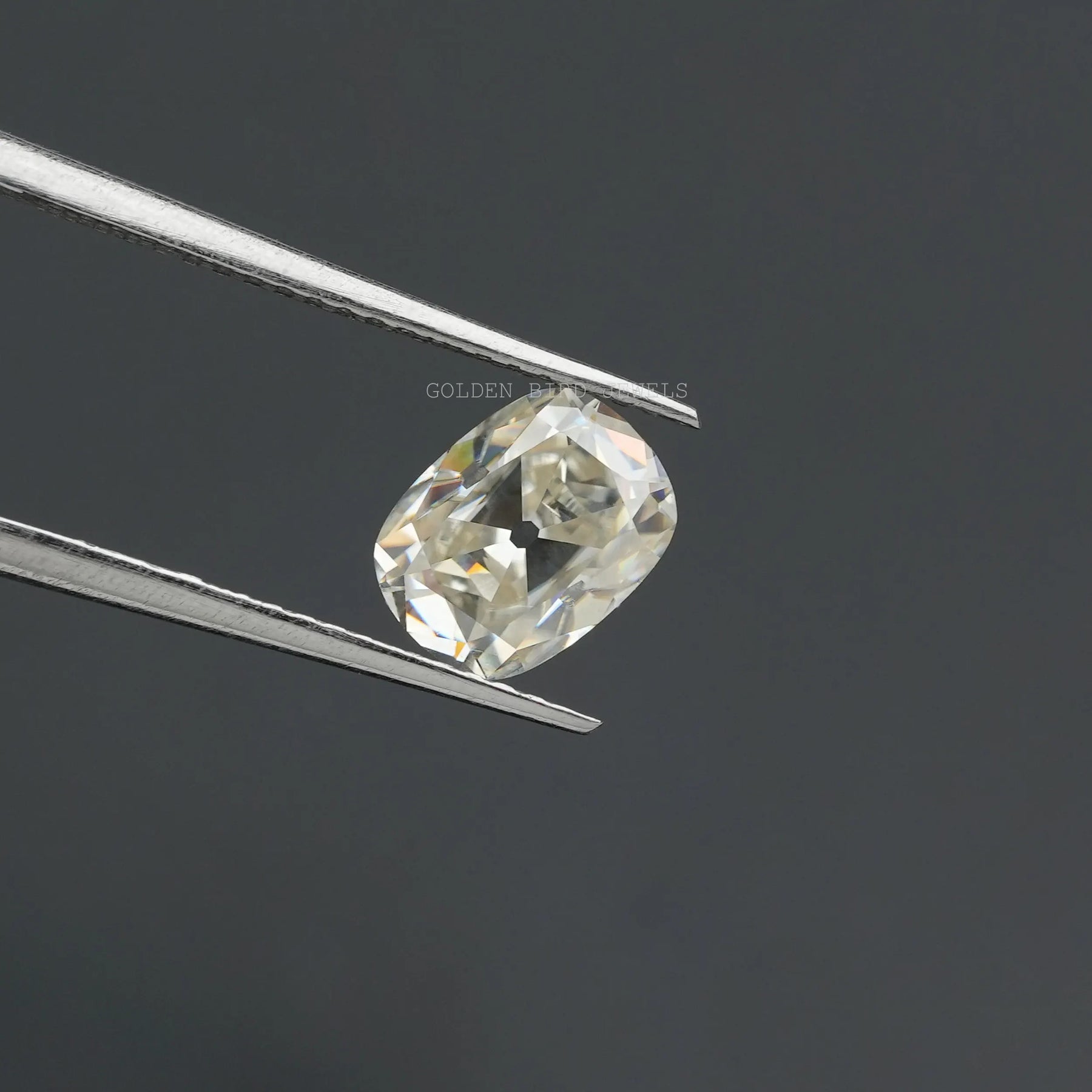 In Tweezers View Of Old Cut Loose Moissanite in Cushion Shaped