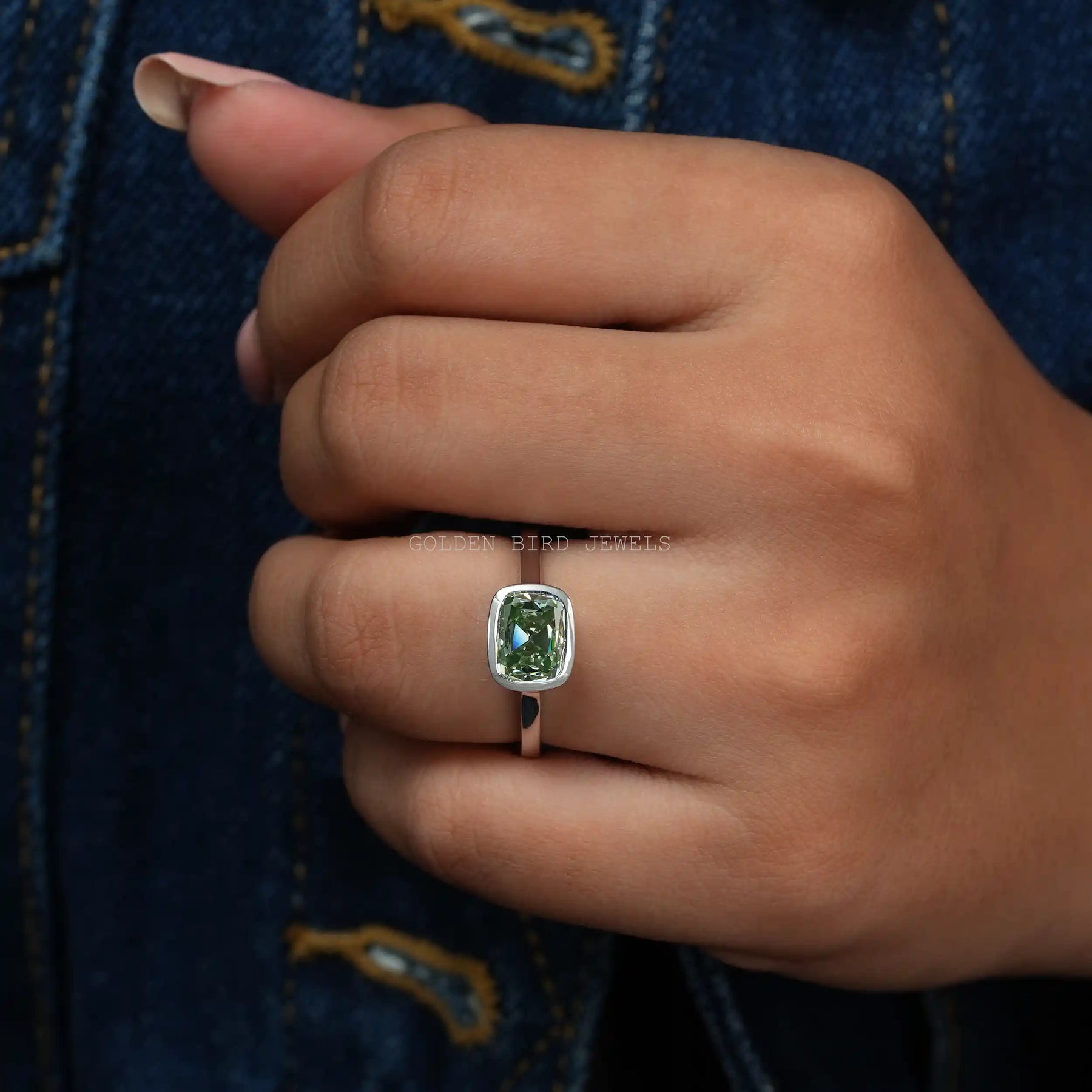 In Finger Front View Of Fancy Mint Green Color Cushion Cut Moissanite Solitaire Ring
