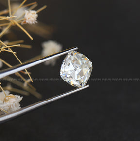 Tweezer view of Old Mine Cushion Cut Stone