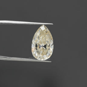 In tweezer Old Mine Cut Pear Shaped Near Colorless Moissanite Stone