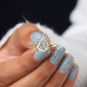 Front View Of Old Pear Cut Moissanite Engagement Ring In Yellow Gold