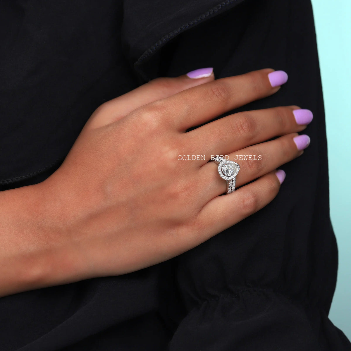 View of Pear Shaped Halo Engagement Ring In Finger