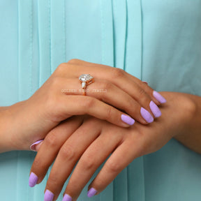 In Finger Side View Of Pear Cut Three Stone Moissanite Engagement Ring