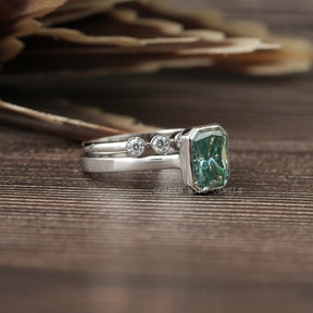 Detailed View of Radiant Cut Blue Moissanite Bezel Set Ring In White Gold