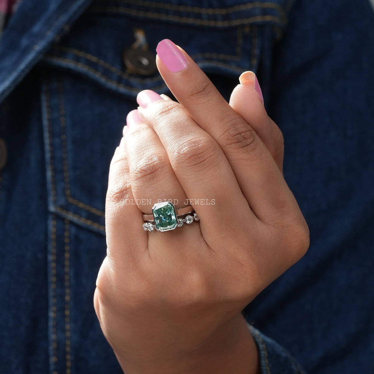 View of Radiant Cut Blue Moissanite Bezel Ring Set In Yellow Gold