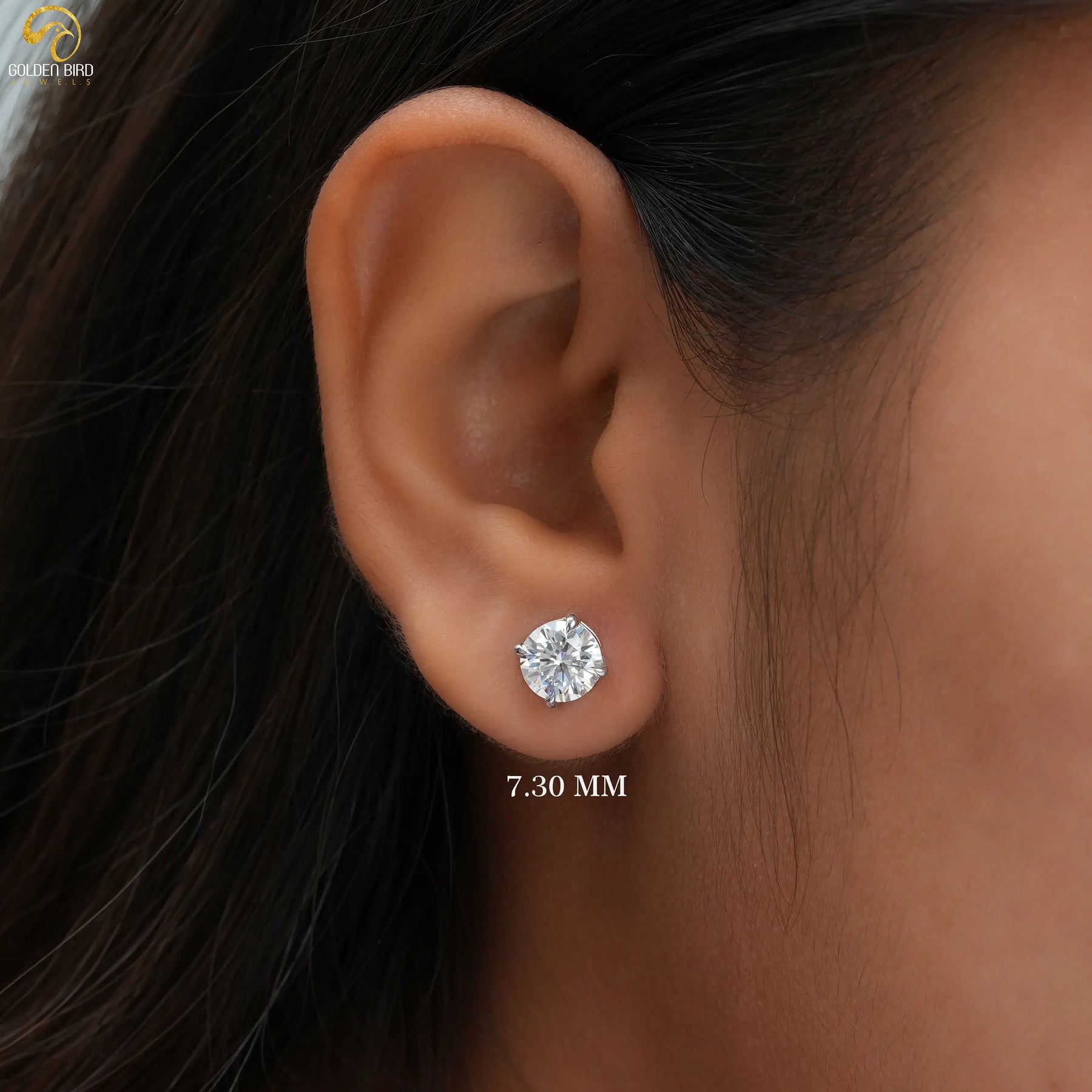 In Ear View Of Four Prong Set Round Cut Moissanite Stud Earrings