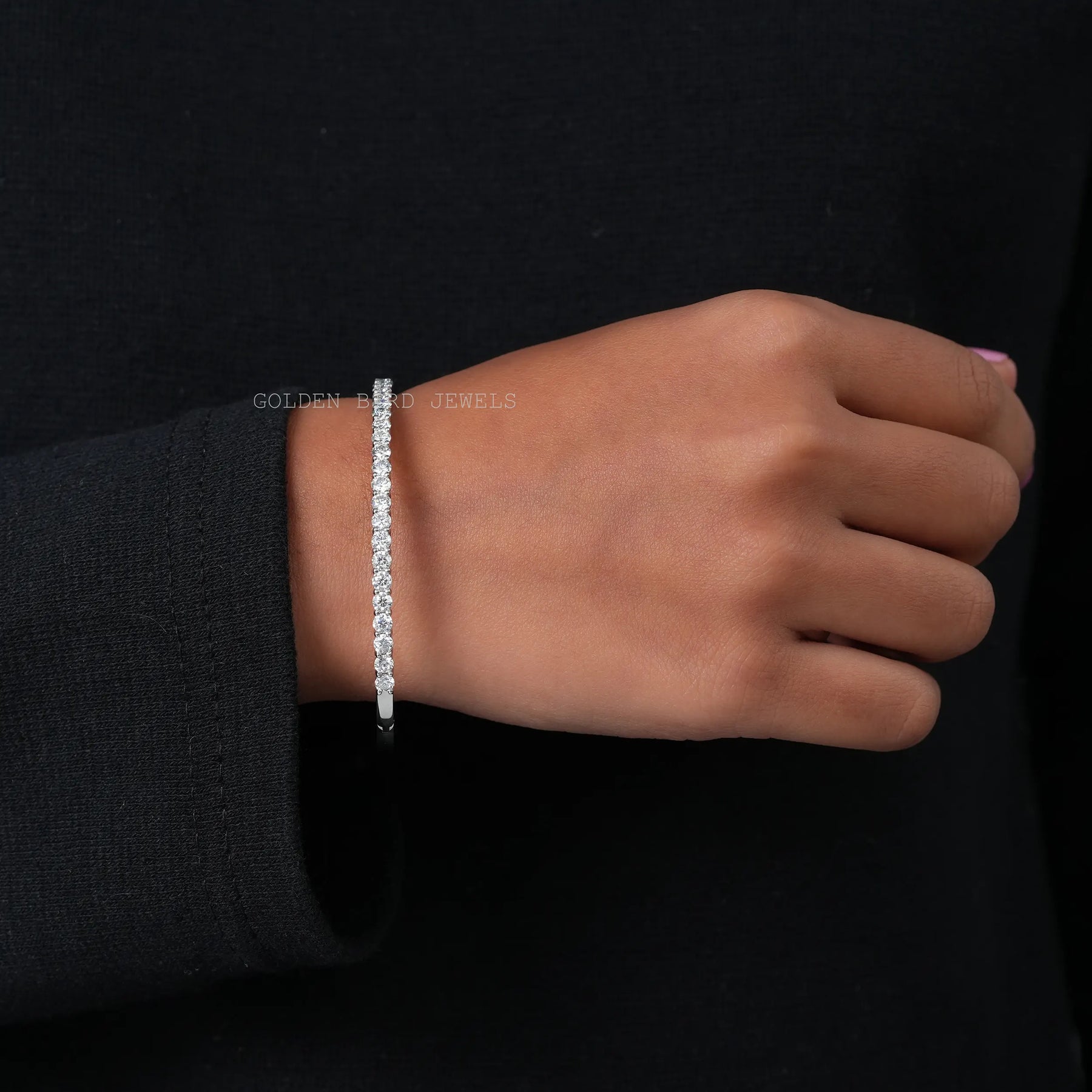 [On hand front view of round cut white gold bracelet]-[Golden Bird Jewels]